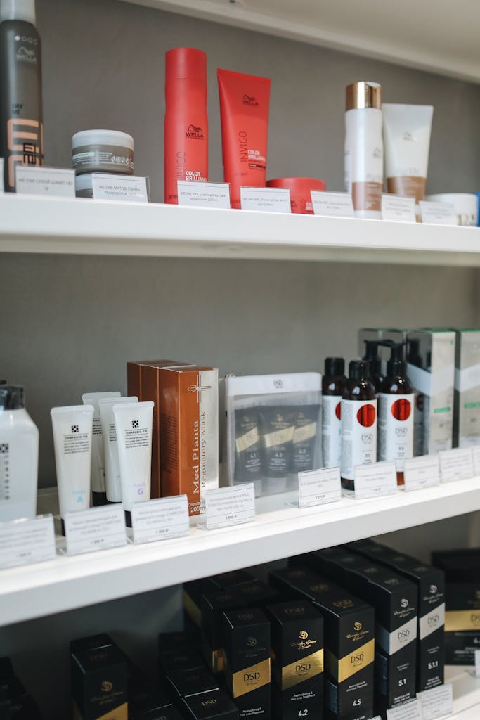 Neatly arranged skincare and beauty products on display shelves, perfect for advertising.